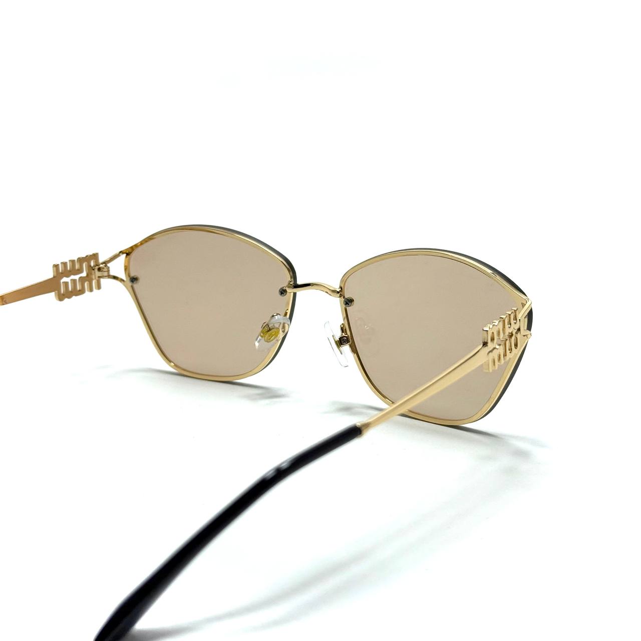 Miu Miu Cat-Eye Metal – Gold / Champagne Bronze