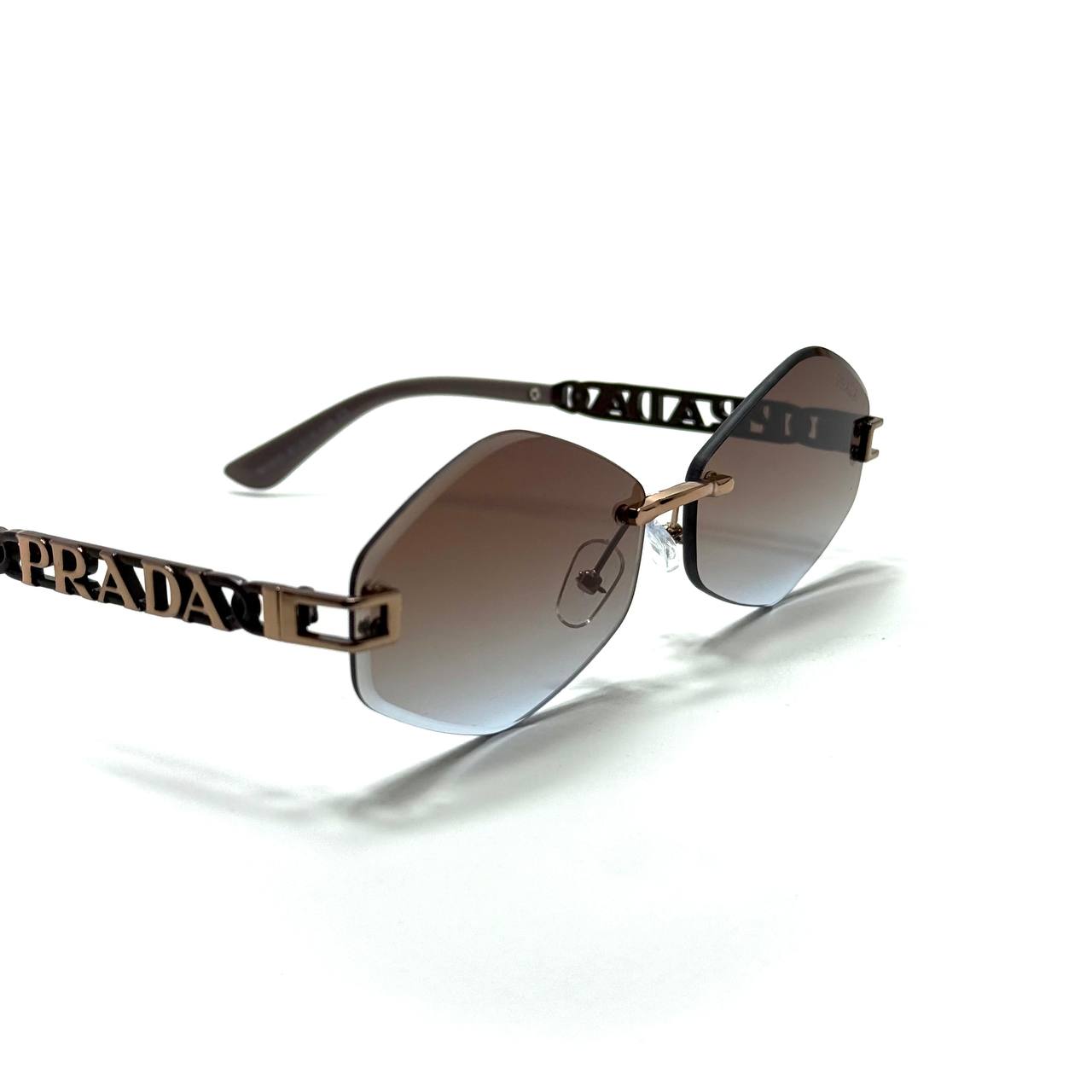 Prada Geometric Rimless Sunglasses – Gold / Brown Gradient