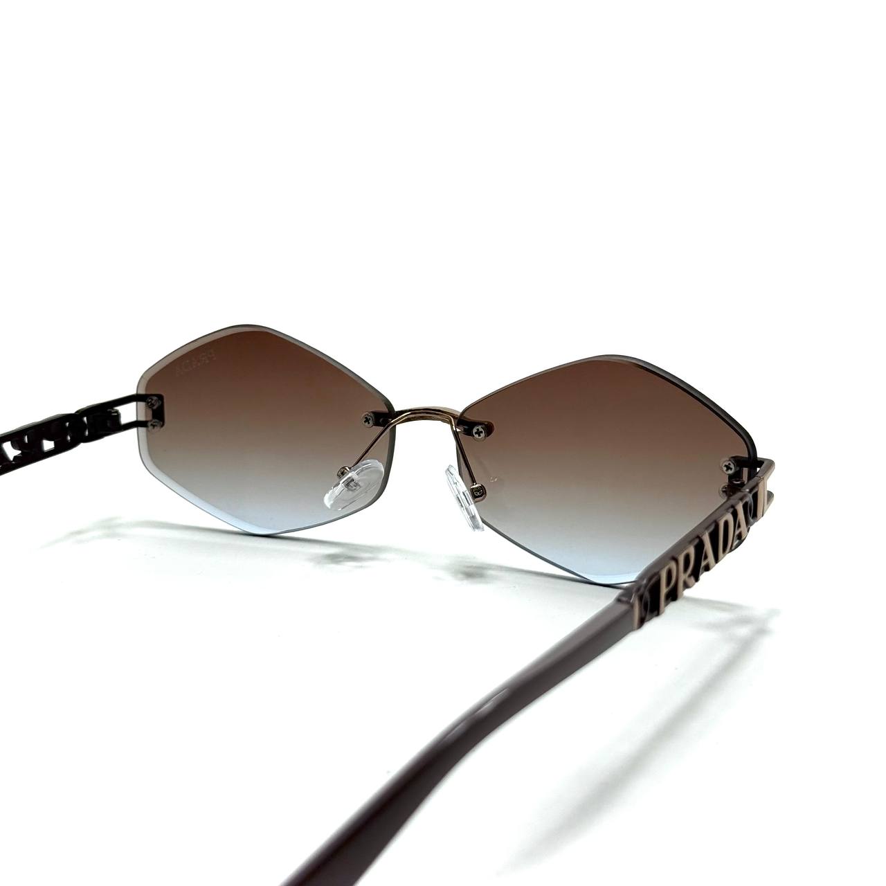 Prada Geometric Rimless Sunglasses – Gold / Brown Gradient
